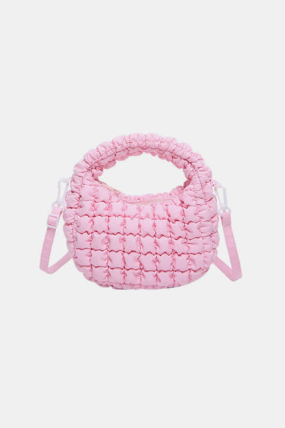 Pink quilted puffy crossbody bag with removable strap, fashion accessory, small size, polyester material.