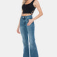 Woman wearing Judy Blue Full Size Tummy Control Cut Hem Flare Jeans, showcasing vintage wash and modern flare design.