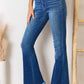 Woman wearing Kancan high rise raw hem flare jeans with front yoke seam and frayed hem for a chic retro look