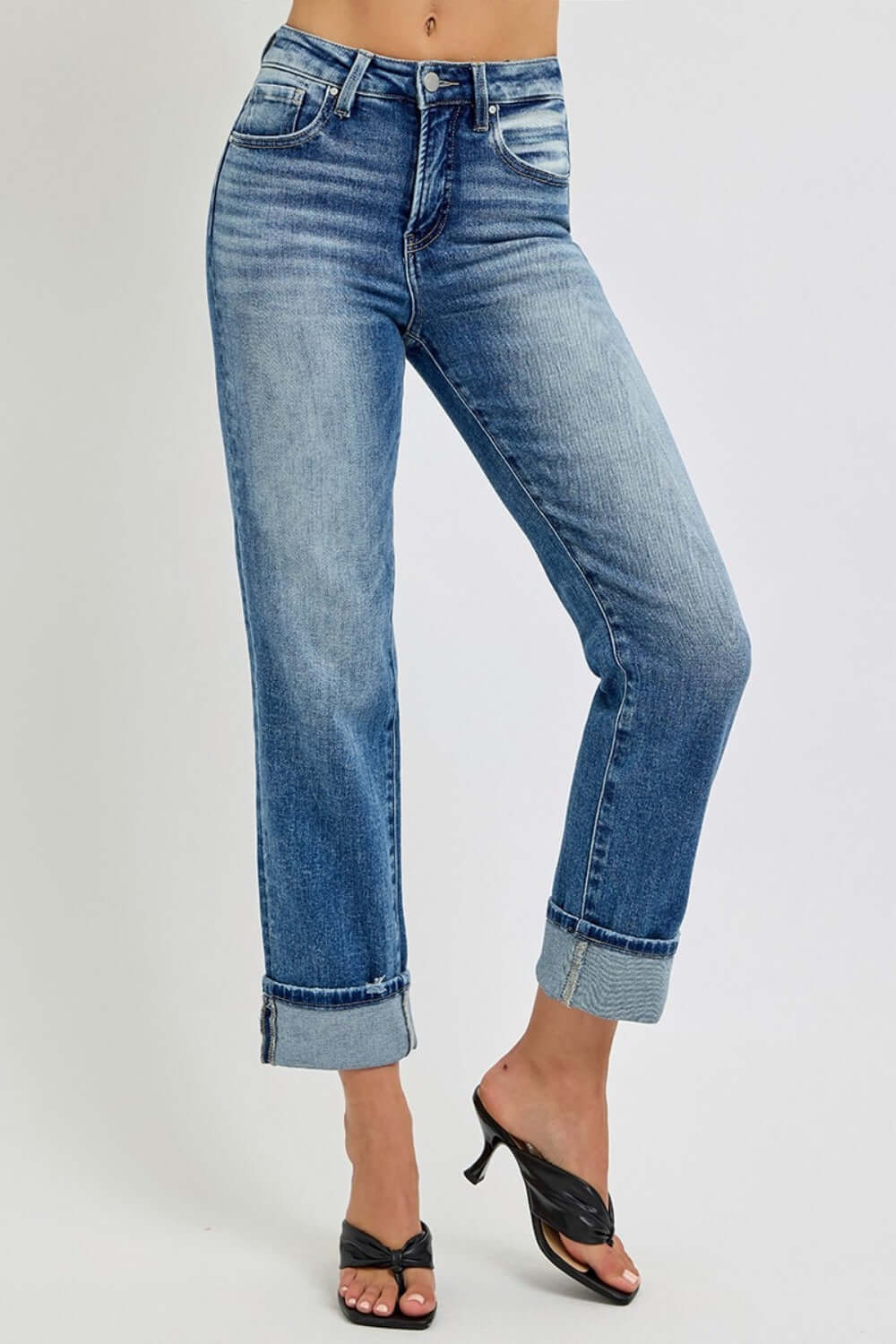 Stylish high-rise crop jeans with rolled-up hem, perfect for casual and special occasions. Versatile wardrobe essential.