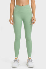 Millennia V-Waist Yoga Leggings in soft green, featuring a flattering fit and convenient pockets for your essentials.