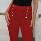 Woman wearing red FAM-FAM high waist skinny pants with decorative buttons, showcasing versatile style and comfort.