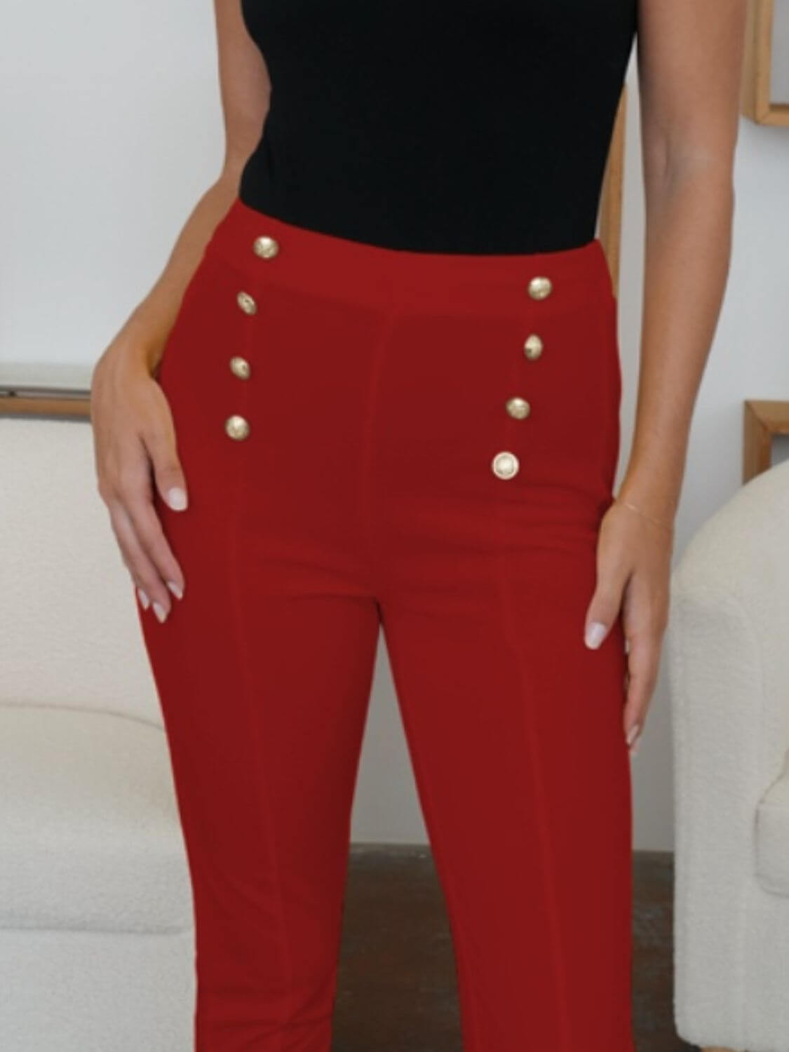 Woman wearing red FAM-FAM high waist skinny pants with decorative buttons, showcasing versatile style and comfort.