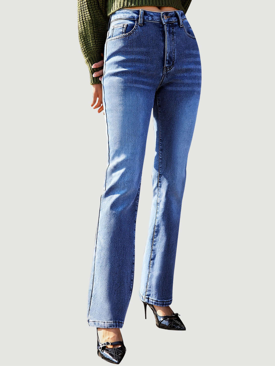 Model wearing Bella Road Straight Leg Jeans with pockets, pairing with green sweater and black shoes