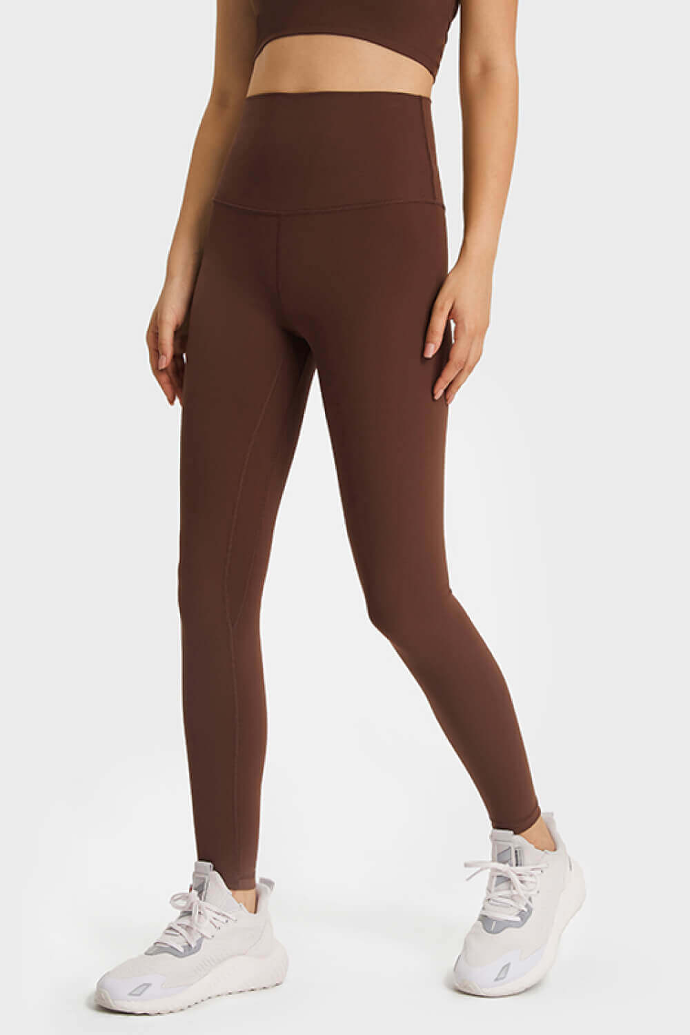 Model showcasing Millennia Ultra Soft High Waist Leggings in brown, perfect for yoga and casual athleisure style.