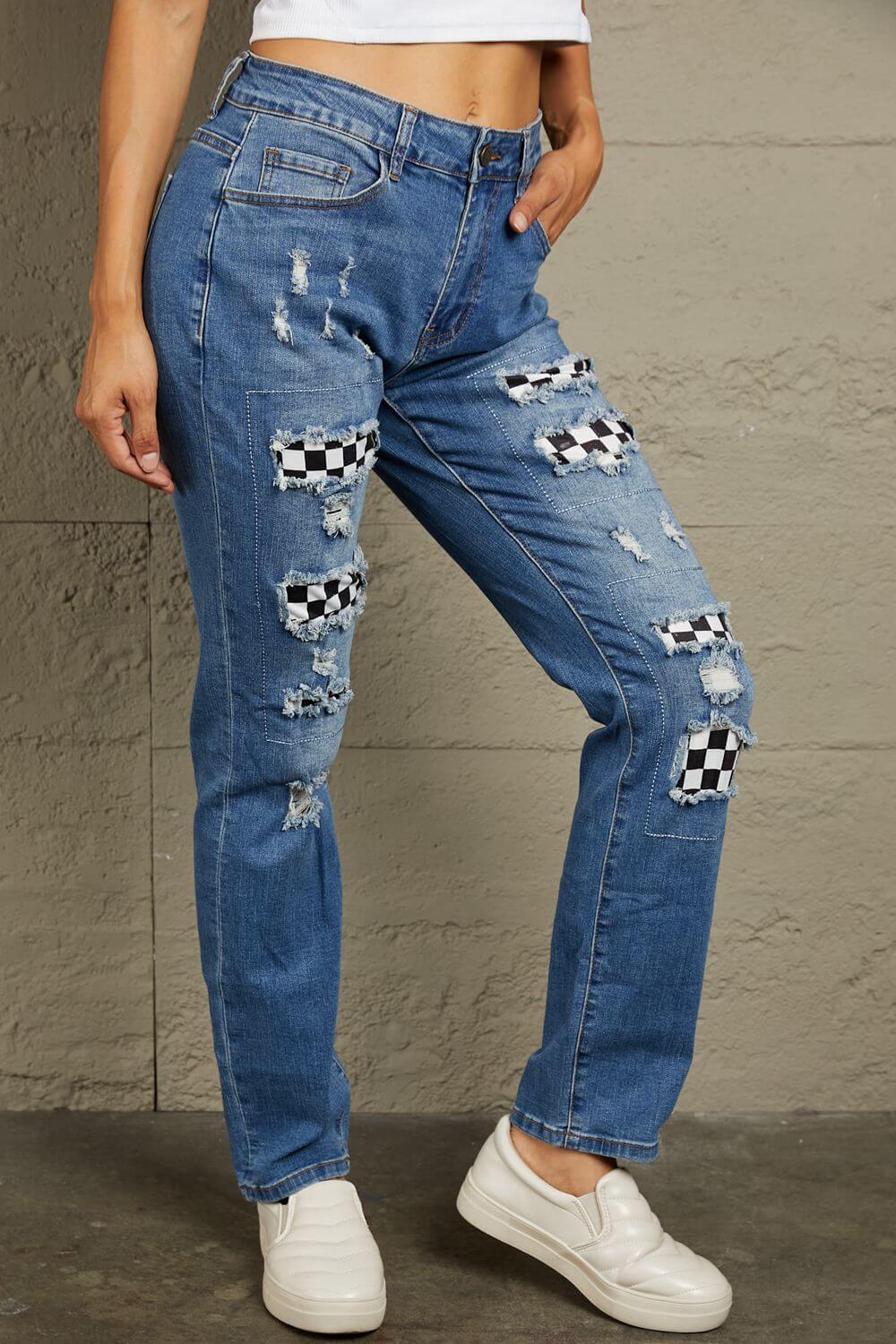 Baeful Checkered Patchwork Mid Waist Distressed Jeans in flat lay, featuring unique patchwork and distressed details.