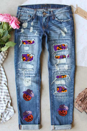 Bella Road Distressed Sequin Pumpkin Jeans with unique distressed design and glittery pumpkin patches.