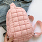 Pink Bella Road Quilted Nylon Crossbody Bag styled with denim jacket, perfect for trendy adventures.