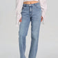 Woman wearing Bella Road Straight Jeans with Pockets, stylish and comfortable for versatile outfits, slightly stretchy denim.