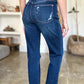 Rear view of person wearing High Waist Rigid Magic Heavy Destroy Straight Judy Blue Jeans with heavy distressing and high waist.