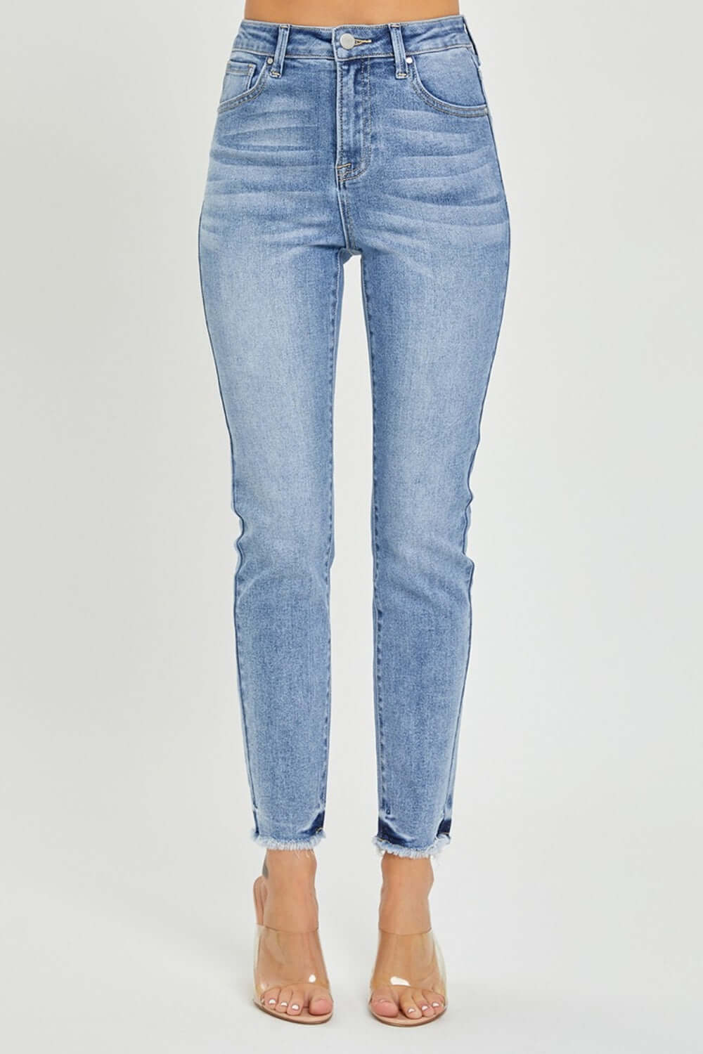 Trendy high rise frayed hem skinny jeans by Risen Jeans showcasing stylish design and flattering silhouette for a chic and effortless look.