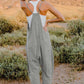 DOUBLE TAKE Full Size V-Neck Sleeveless Jumpsuit with Pockets at Bella Road