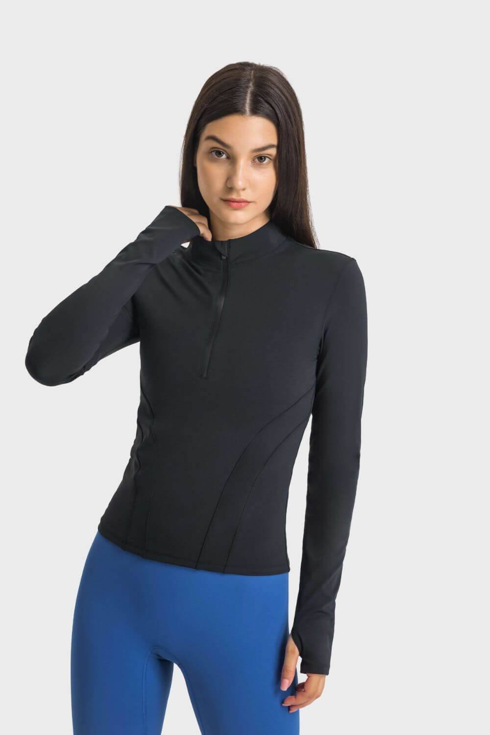 Millennia Half Zip Thumbhole Sleeve Sports Top in black, perfect for yoga and workouts, featuring a stylish design and comfortable fit.