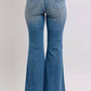 Back view of Judy Blue Mid Rise Tummy Control Vintage Wash Jeans showcasing a flattering vintage design and flare.