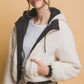 Woman wearing Love Tree Zip-Up Cropped Hooded Sherpa Reversible Jacket in cozy white, showcasing versatile and stylish outerwear.