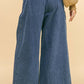 Back view of Davi & Dani drawstring hem wide leg mid-rise jeans, showcasing a stylish and comfortable fit.