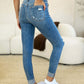 Mid Rise Destroy & Cuff Skinny Judy Blue Jeans with destroyed detailing and cuffed hem, showcasing a flattering and stylish look.