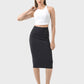 Model showcasing the Millennia Slit Wrap Active Skirt with a white crop top and stylish sneakers in a minimalistic setting.