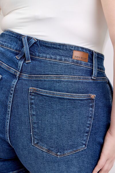 Close-up of Judy Blue plus size double button waistband denim shorts showcasing flattering high-waisted design.