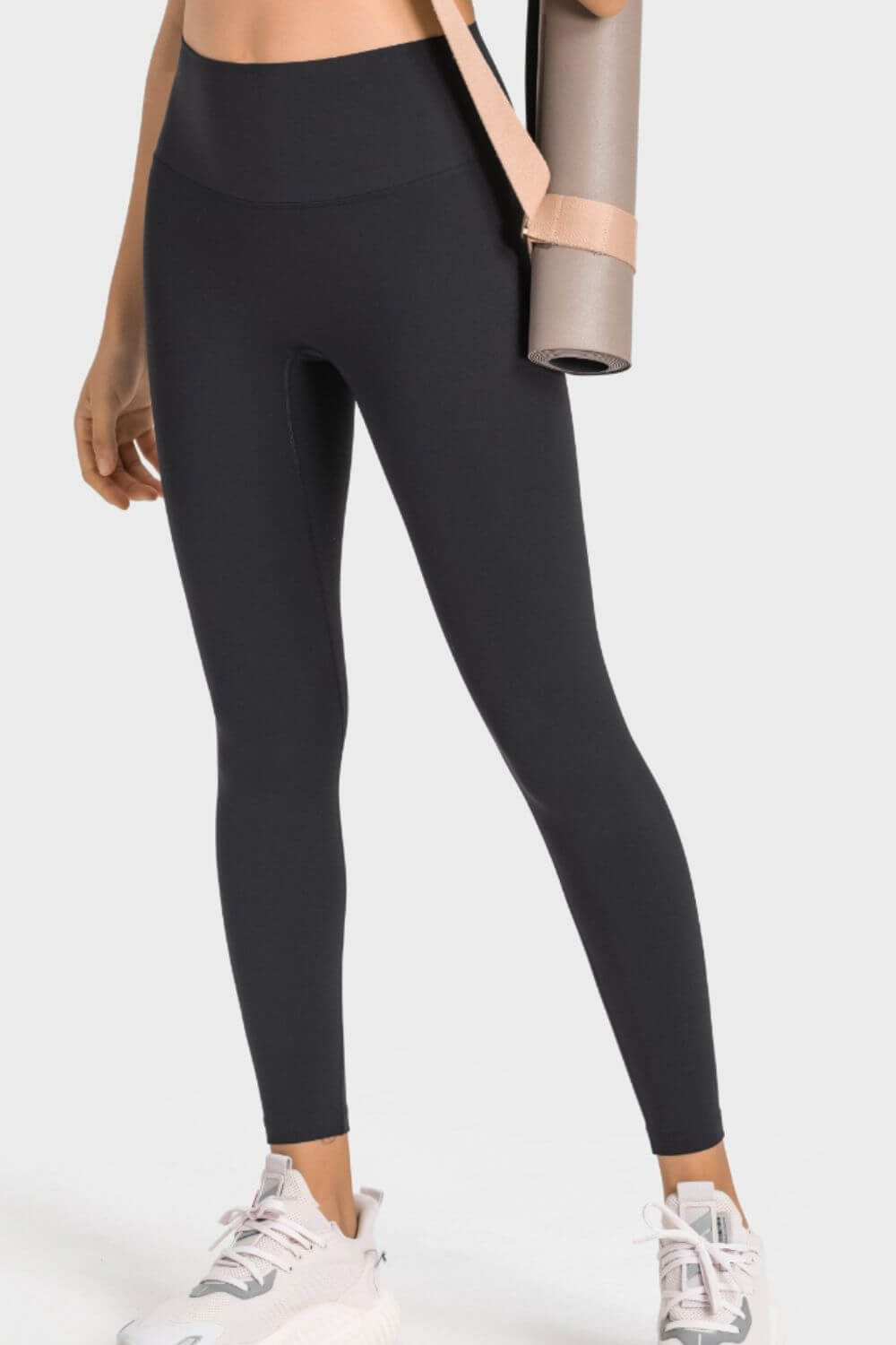 Millennia High-Rise Yoga Leggings in black, showcasing a wide waistband and sleek fit, perfect for yoga practice.