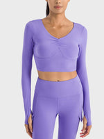 Millennia Ruched Cropped Long Sleeve Sports Top in purple, featuring stylish ruched design and a trendy cropped fit.