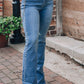 Stylish Pearl Trim High Waist Bootcut Jeans with heart belt, perfect for a chic street look.