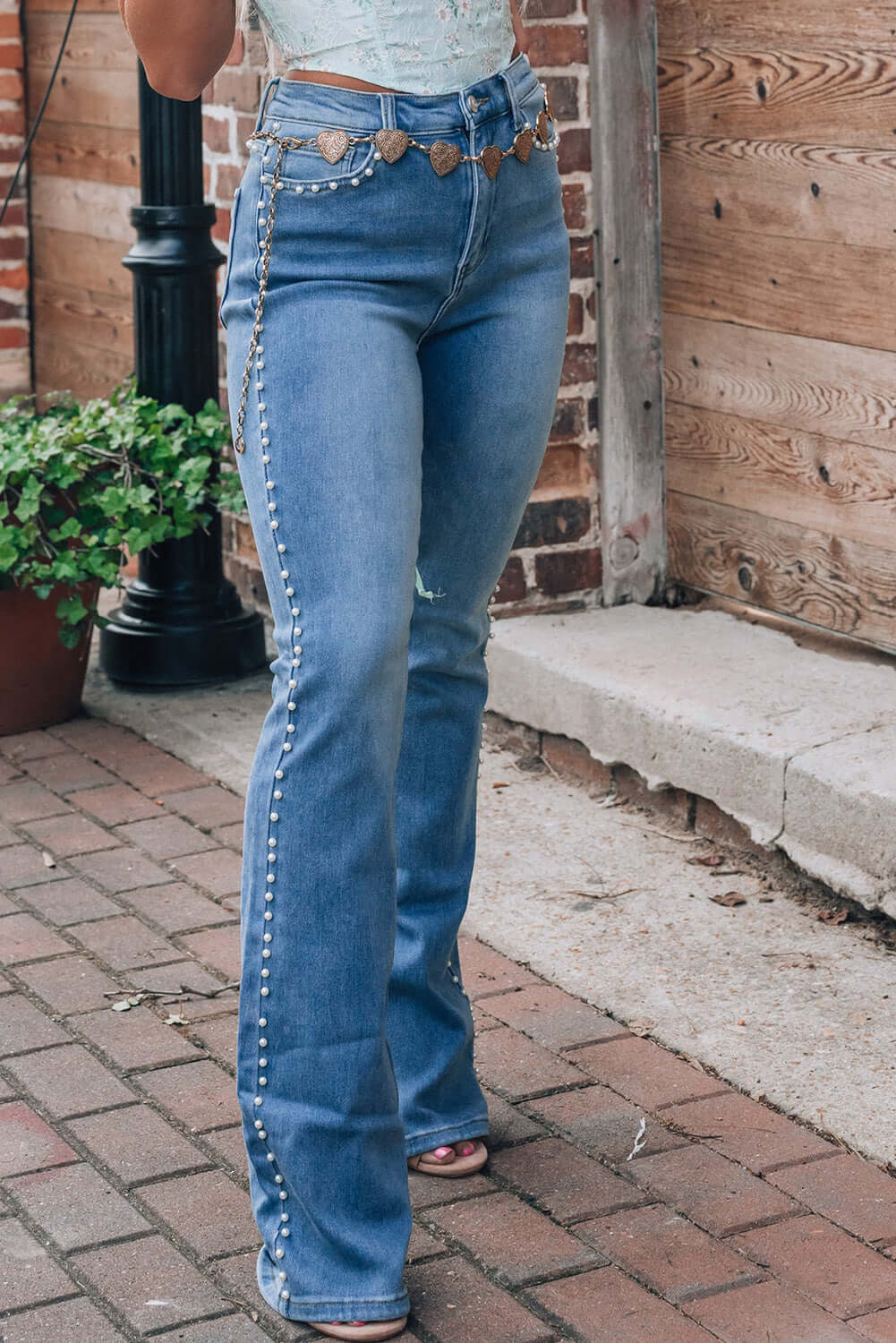 Stylish Pearl Trim High Waist Bootcut Jeans with heart belt, perfect for a chic street look.