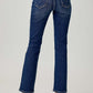 Back view of high waist straight jeans by Risen Jeans, featuring a classic straight leg fit and back pockets, paired with nude heels.