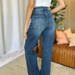 Woman wearing RFM Full Size High Rise Tummy Control Wide Leg Jeans with wide-leg cut, showing back view for style and fit.