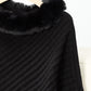 Close-up of Bella Road Fuzzy Trim Poncho showcasing soft black fabric and cozy fur collar detail. Perfect for stylish warmth!