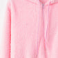 Soft pink quarter-zip teddy hoodie with drawstring and cozy texture, perfect for casual wear.