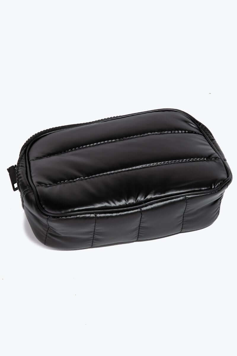 Black quilted nylon crossbody bag showcasing a stylish, practical design perfect for everyday accessories.