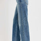 Plus size distressed wide leg jeans, relaxed fit, stylish and trendy denim for a casual chic look.