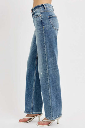 Plus size distressed wide leg jeans, relaxed fit, stylish and trendy denim for a casual chic look.