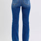 Back view of Judy Blue mid-rise bootcut jeans with thermal lining, showcasing the flattering fit and classic style.