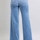 Back view of Judy Blue wide leg jeans in light blue, showcasing pockets and a relaxed vintage-inspired silhouette.