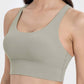 Stylish olive green crisscross scoop neck active tank, perfect for workouts with comfort and breathability.