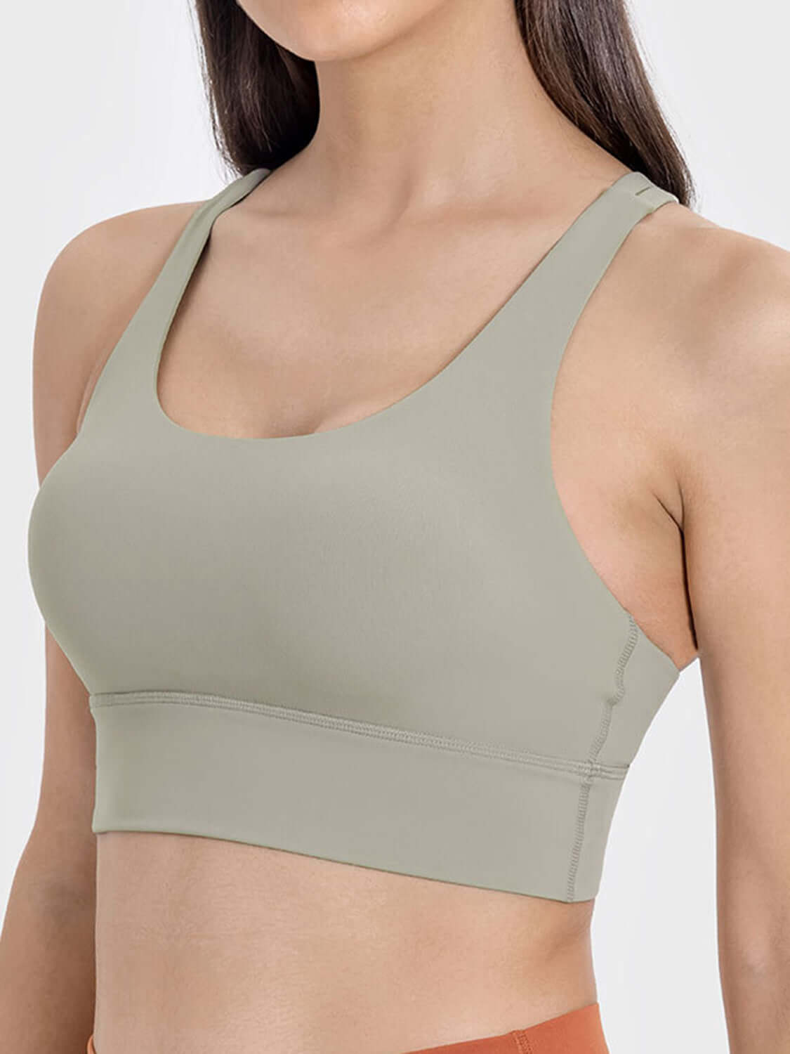 Stylish olive green crisscross scoop neck active tank, perfect for workouts with comfort and breathability.