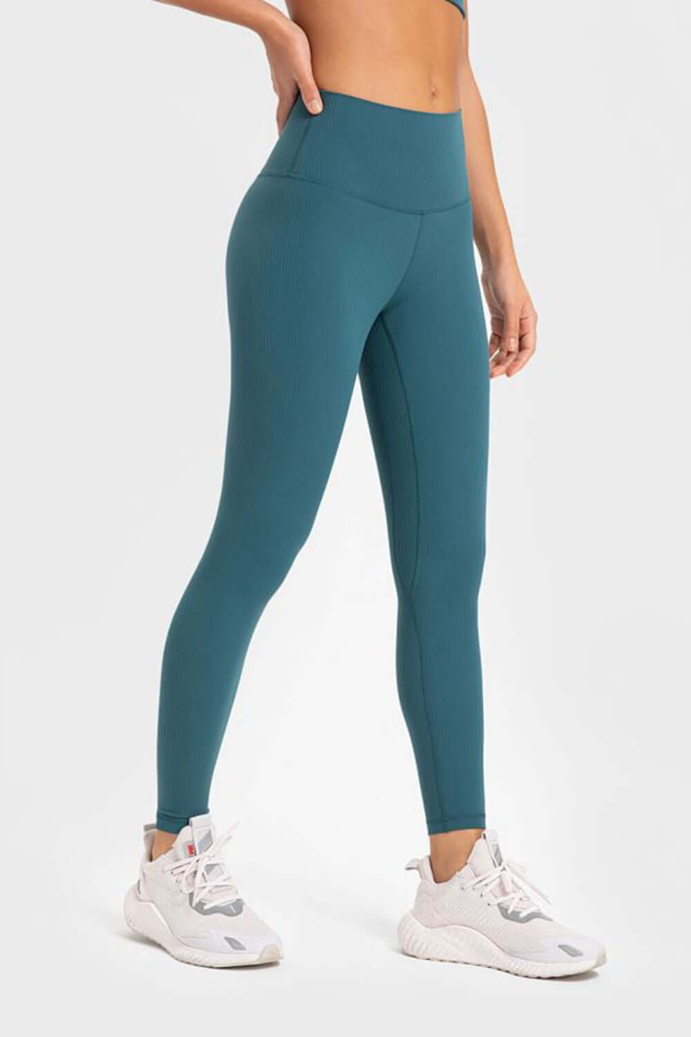 Millennia highly stretchy yoga leggings in teal with wide waistband, perfect for comfort and flexibility in workouts.