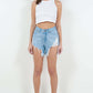 High Waist Fringed Hem Denim Shorts styled with a white crop top, showcasing a trendy summer fashion look