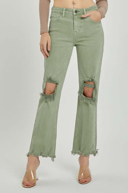 Distressed ankle bootcut jeans with frayed hems and knee rips, ideal for petite silhouettes. Trendy Risen Jeans for a laid-back style.