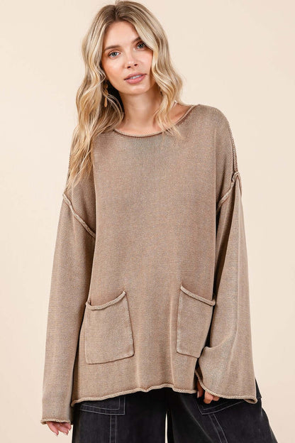 Trendy mineral wash sweater with patch pockets and cut edges, perfect for a chic, relaxed look. Cozy casual outfit essential.