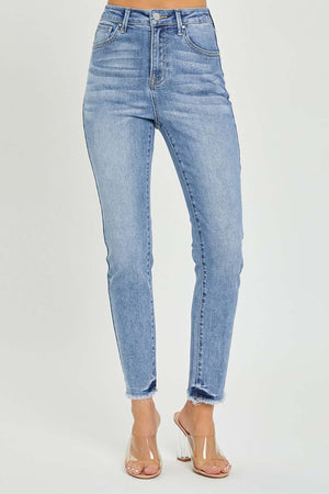 High rise frayed hem skinny jeans in light blue denim with a skinny fit, flattering silhouette, and stylish frayed hem, perfect for any outfit.