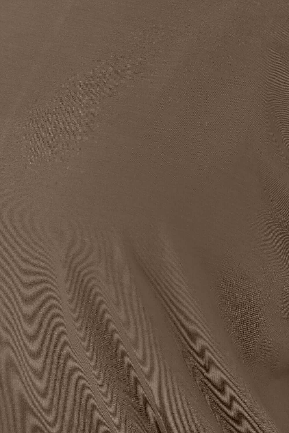 Detailed close-up of the slightly stretchy rayon and spandex blend fabric used in the Round Neck Batwing Sleeve Top.