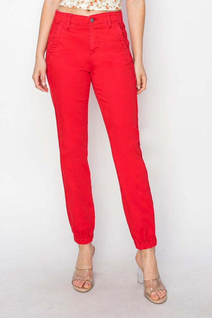 Red high-waisted jogger jeans with a relaxed silhouette, combining style and comfort for a flattering fit.