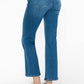 Model showcasing bytos Cat's Whiskers Mid Rise Ankle Jeans from the back, featuring a flattering fit and playful detailing.