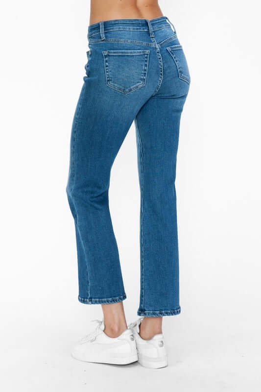 Model showcasing bytos Cat's Whiskers Mid Rise Ankle Jeans from the back, featuring a flattering fit and playful detailing.