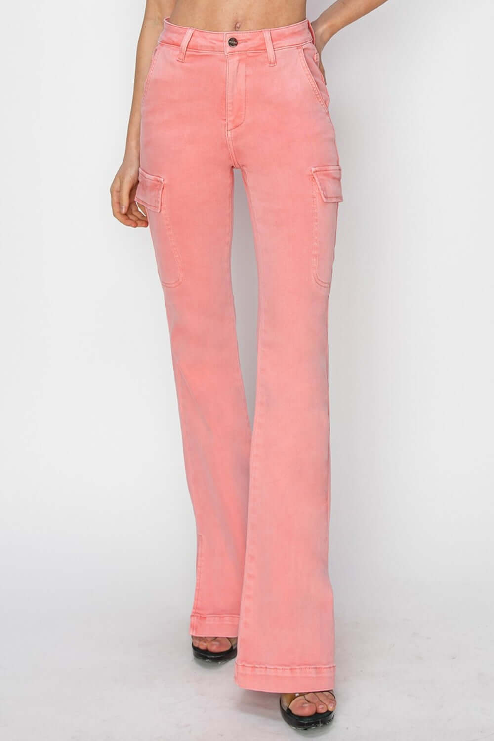 High-rise side slit cargo bootcut jeans in pink, featuring utilitarian pockets and a trendy bootcut silhouette by Risen Jeans.