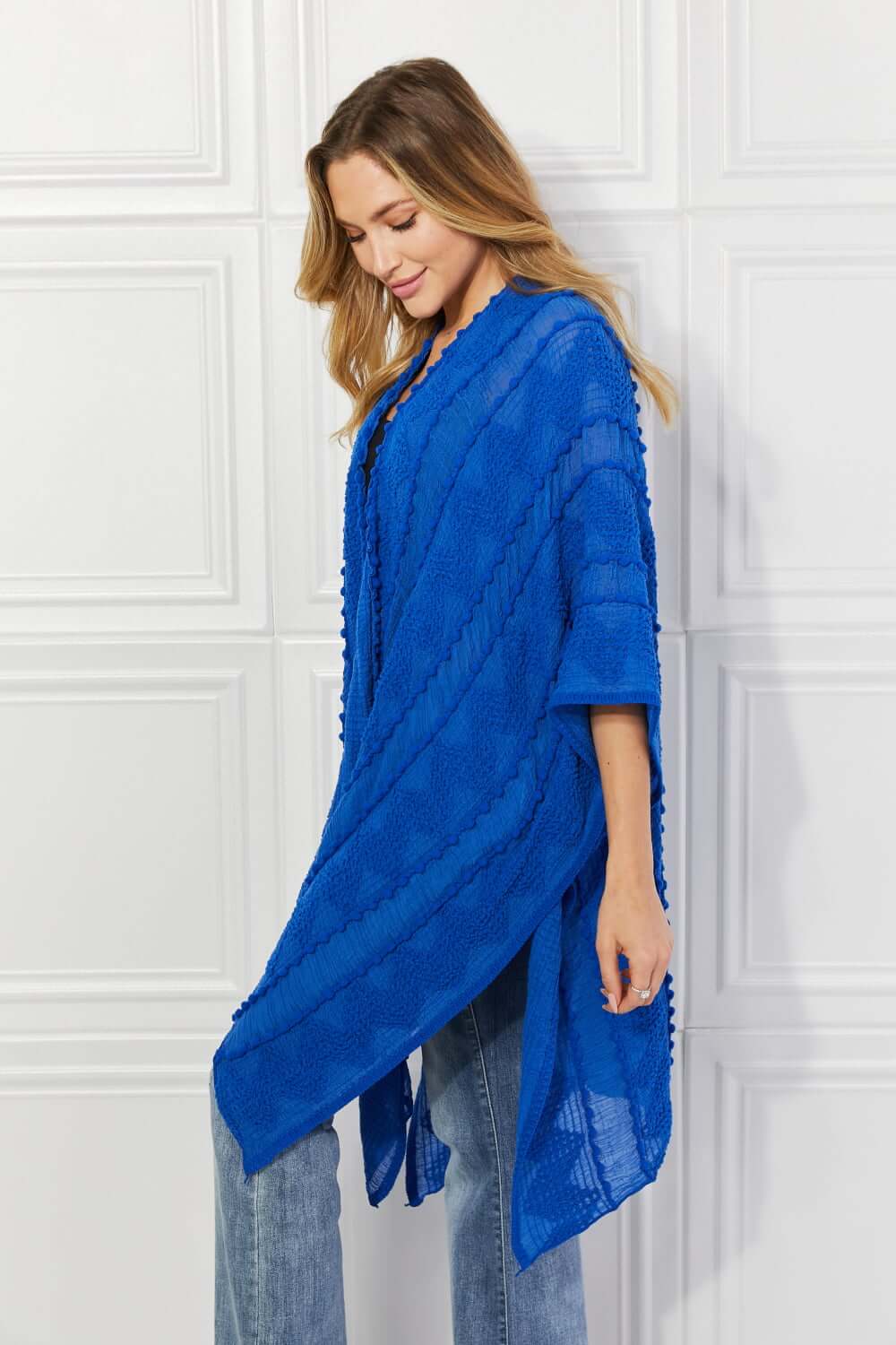 JUSTIN TAYLOR Pom-Pom Asymmetrical Poncho Cardigan in Blue at Bella Road