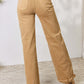 Risen Jeans Wide Leg Fringe Hem Jeans in tan, showcasing rear view with pocket details and slightly frayed edges.